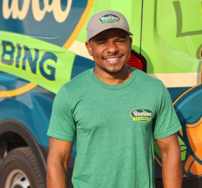 man in a green shirt smiling